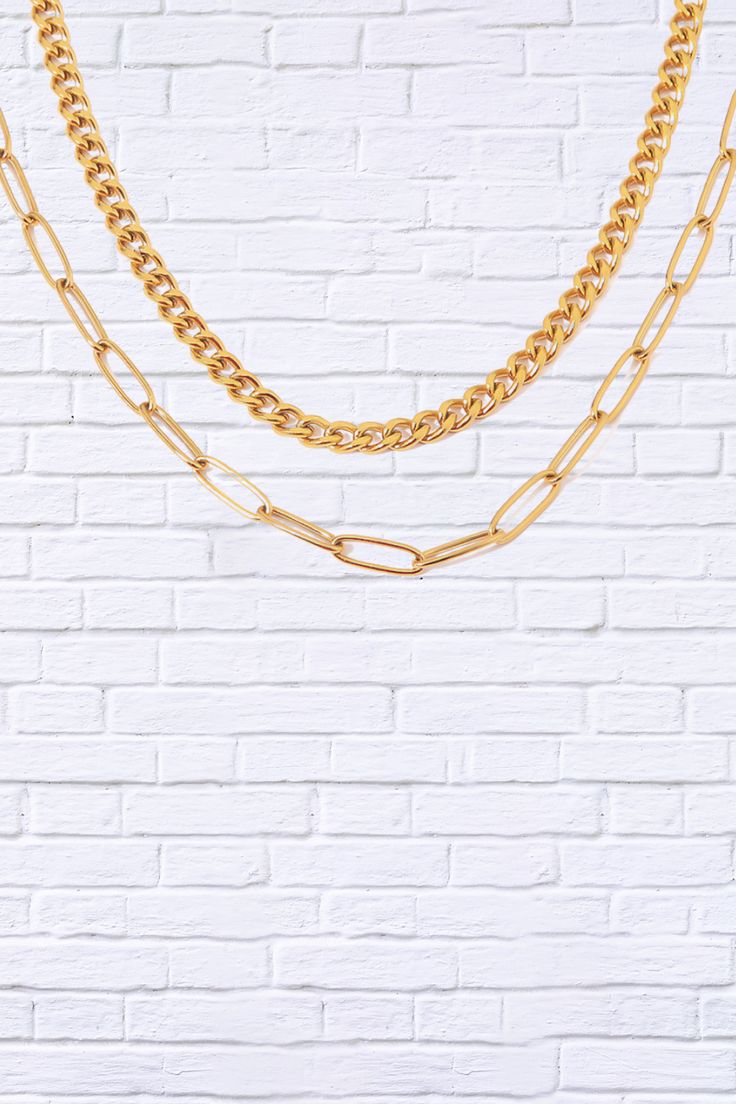 Step up your style game with our 18K Gold Plated Layered Chain Necklace, a statement piece that effortlessly combines elegance and trendiness. This layered necklace features multiple delicate chains, each plated in luxurious 18K gold, creating a stunning, layered look that adds depth and dimension to any outfit. Whether you’re dressing up for a night out or adding a touch of glam to your everyday attire, this versatile necklace is designed to make you shine. Key Features: 18K Gold Plating for a Gold Double Chain Link Necklace, Gold Link Chain Necklace With Double Chain, Gold Plated Multi-strand Double Chain Necklace, Gold Plated Double Chain Choker, Gold Double Strand Figaro Chain Necklace, Multi-strand Layered Necklace With Chunky Chain As Gift, Trendy Double Strand Chunky Chain Necklace, Multi-strand Chunky Chain Layered Necklace As Gift, Multi-strand Chunky Chain Layered Necklace For Gifts