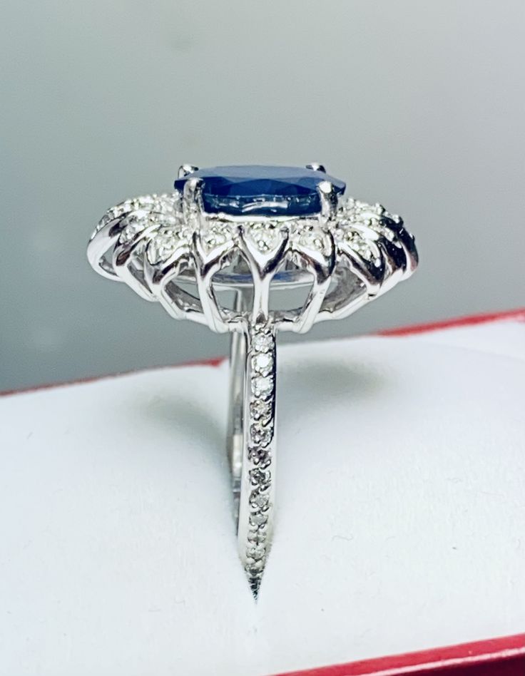 Beautiful 14k White Gold Natural Sapphire and Diamond Ring : Natural Sapphire: 3.12 CT Side Diamonds: 0.50CT Color: G Clarity: SI1 Total ring weight: 6.2GR 14K White Gold Free Ring sizing available For more information regarding this item feel free to reach me so I can accommodate your needs. Thank you Estate White Gold Rings For Gift, Estate Style White Gold Rings As Gift, Hallmarked Estate White Gold Rings, Estate White Gold Rings, Estate Oval Rings For Formal Occasions, Estate White Gold Jewelry As A Gift, Estate Style Oval Rings For Formal Occasions, Estate Style White Gold Jewelry As Gift, Formal Oval Estate Rings