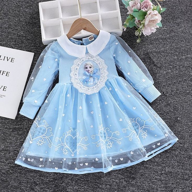 This high-quality long-sleeved Toddler Girls Elsa Dress is crafted from soft, breathable cotton and mesh, with a stylish ball gown silhouette and adorable cartoon design. Perfect for putting on a royal display at any time, this dress is designed for girls aged 2-8 years. Comfortably lightweight, the dress also features a full-length sleeve and a flattering O-neck. Let her experience the enchantment of Arendelle with this stunning Elsa dress--perfect for dress-up games with her pals! Transform yo Long Sleeve Tutu Dress For Dress-up In Spring, Long Sleeve Tutu Dress For Spring Dress-up, Cute Long Sleeve Dress For Dress-up, Cute Long Sleeve Dress-up Dresses, Long Sleeve Princess Dress For Dress-up, White Long Sleeve Princess Dress, Light Blue Long Sleeve Cotton Dress, Blue Long Sleeve Princess Dress For Spring, Tulle Long Sleeve Princess Dress For Dress-up