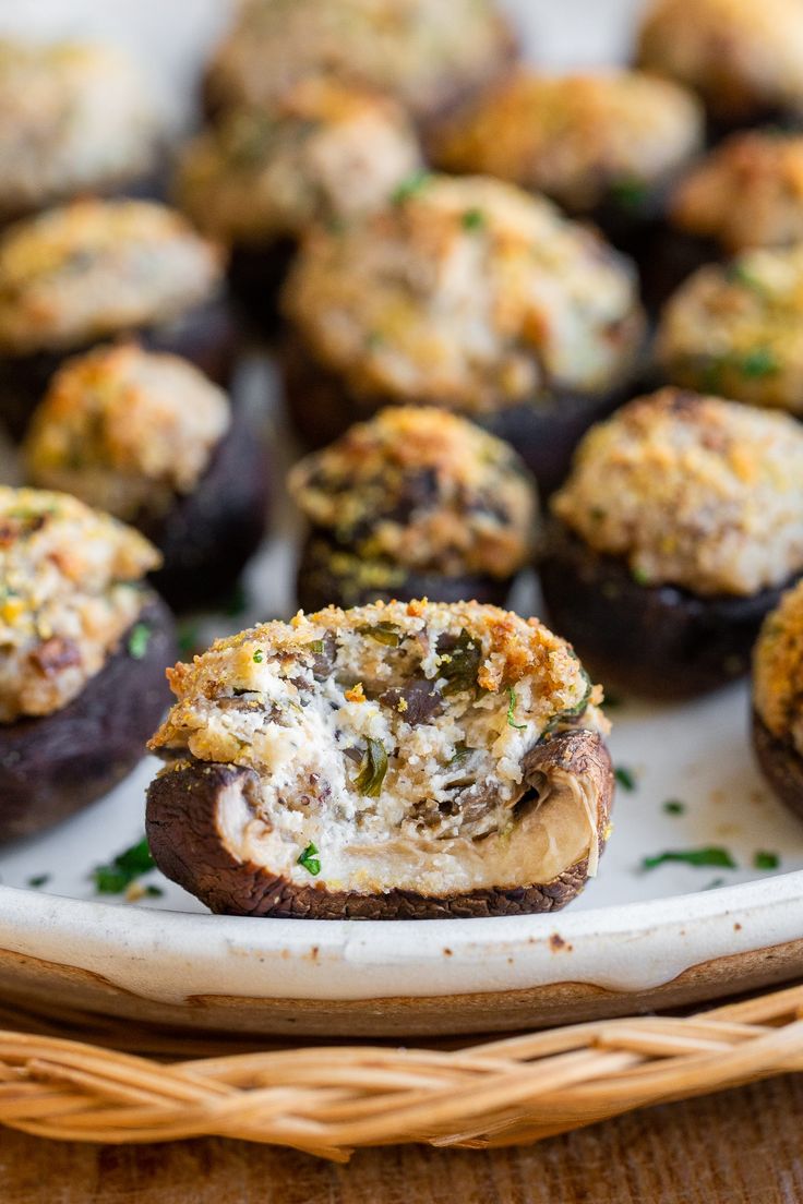 baked stuffed mushrooms on a plate with parsley