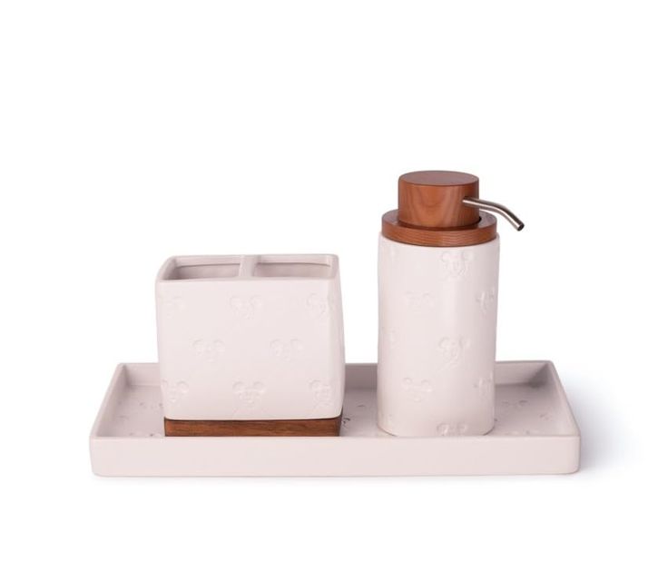 a white and brown bathroom set with soap dispenser