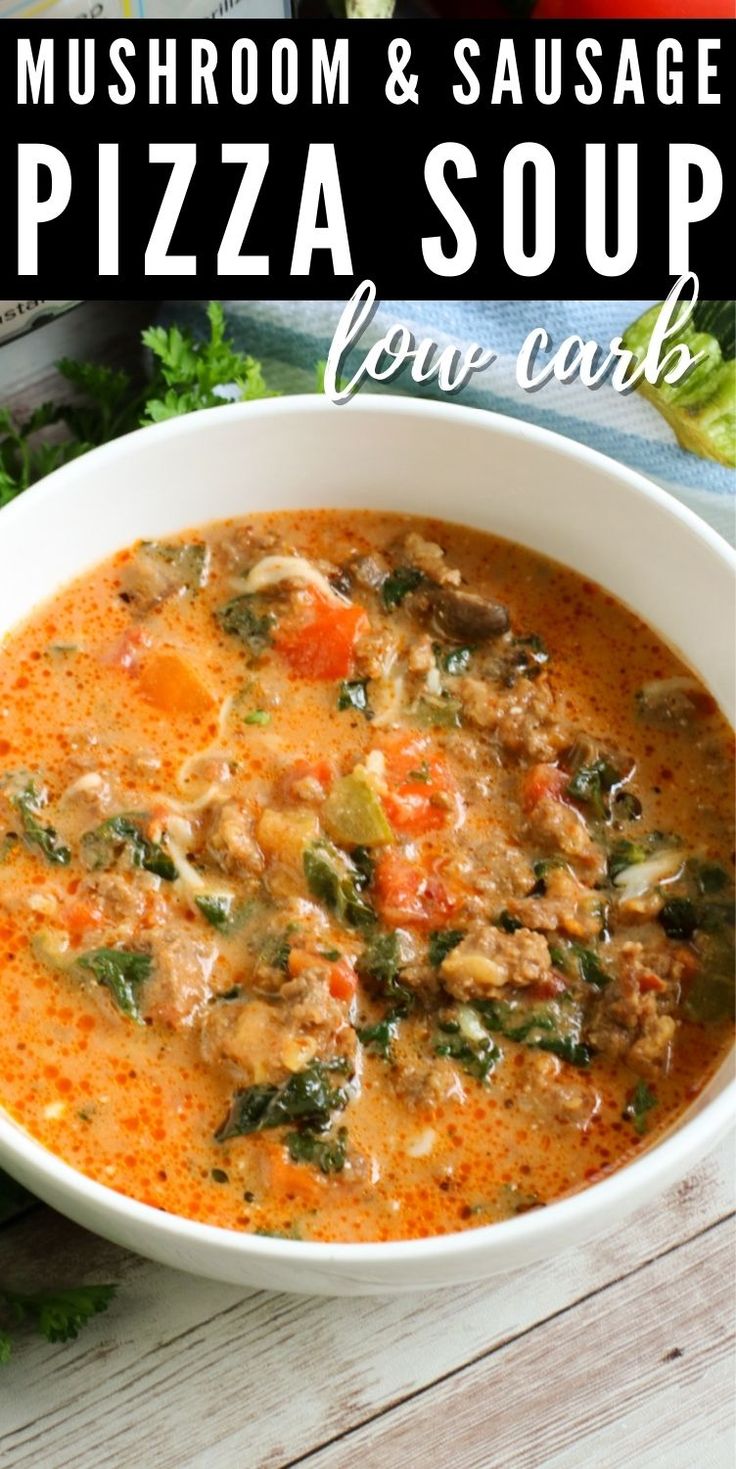 mushroom and sausage pizza soup in a white bowl on a wooden table with parsley