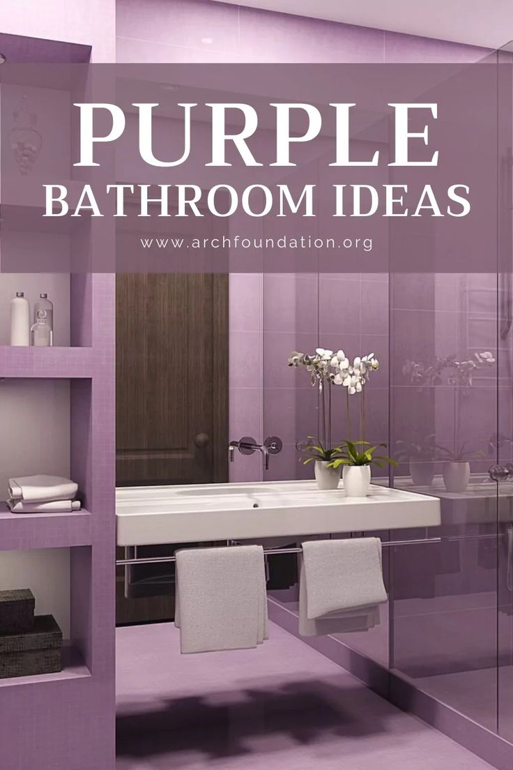 a bathroom with purple walls and shelving in the middle, along with white towels