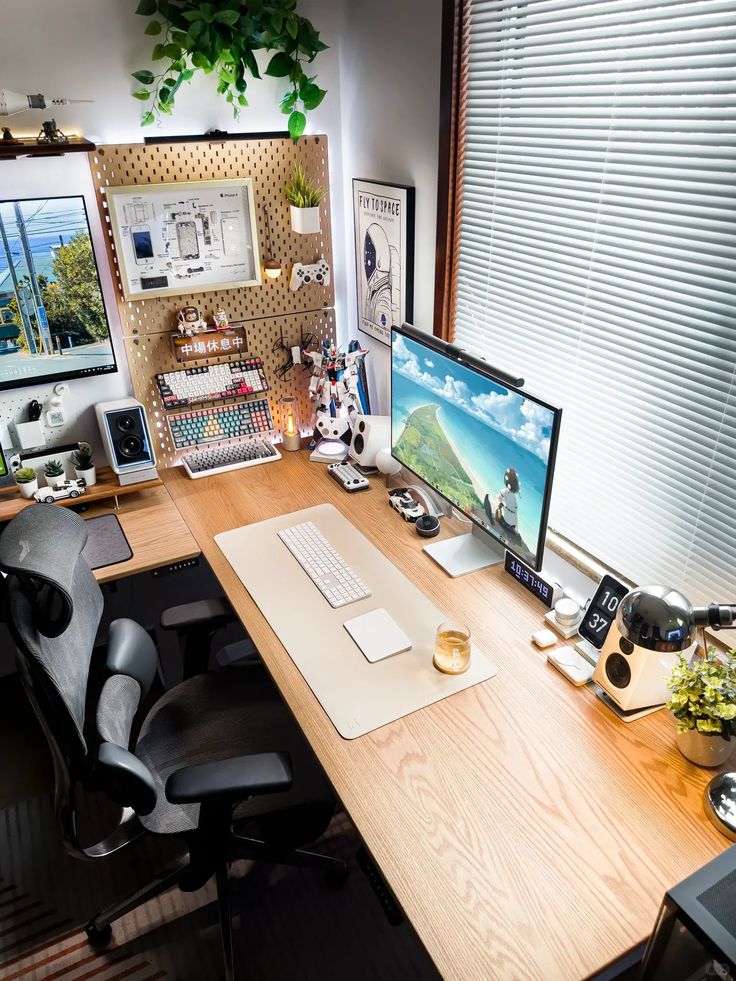 an office desk with two computers on it