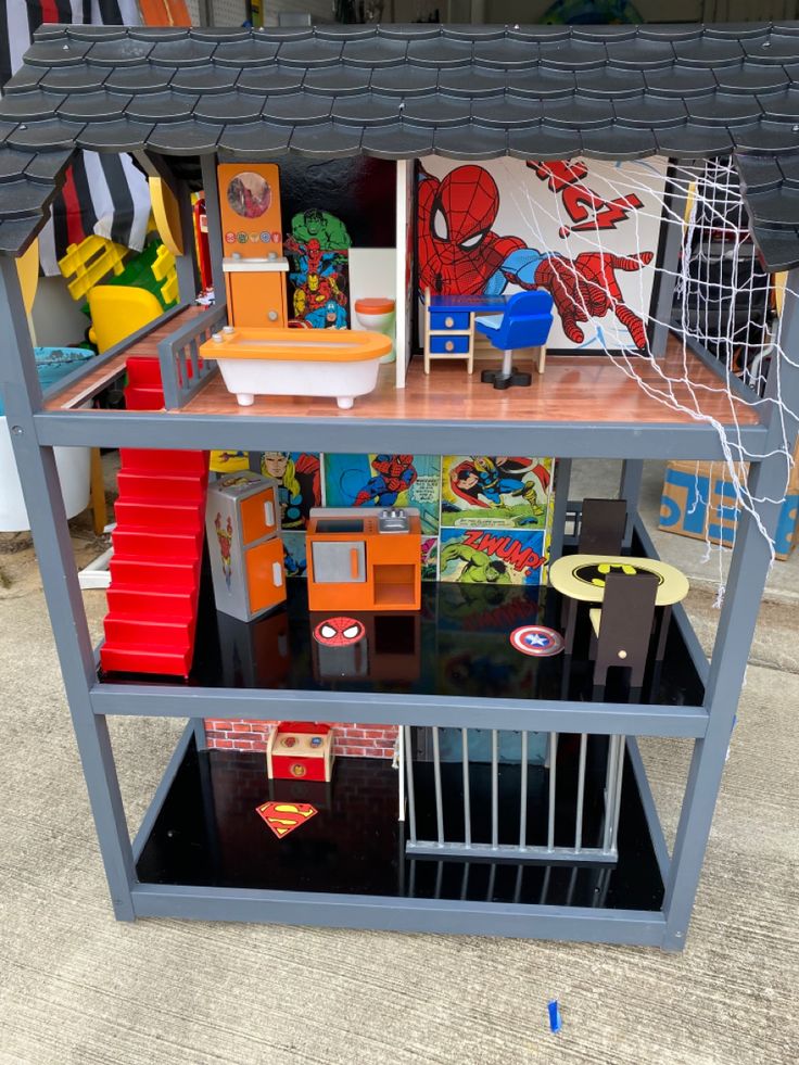 a doll house with furniture and accessories on display