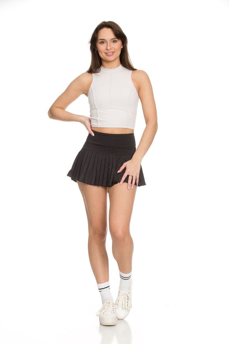 Next Restock Now Available for Pre-Order. NEW 2.0 Black Pleated Tennis Skirt is back and BETTER than ever. Now offering more sizes and sizing accuracy. Just like the original, it is best everyday piece to add to your wardrobe because of its versatility & functionality. The skirt features built-in spandex shorts that include a comfortable fit and side pockets for storage. This exclusively designed Gold Hinge skirt is made of quick dry material and can take on any activity such as golf, tennis, ru Gold Hinge Skirt, Lululemon Skirt, Pleated Tennis Skirt, Athletic Skirt, Tennis Skirts, Spandex Shorts, Athletic Top, Yoga Tops, Intense Workout