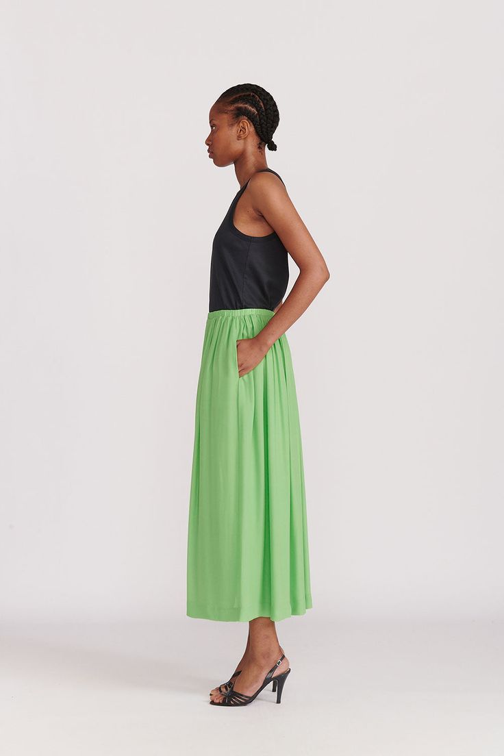 A Gathered ankle length skirt with elastic waistband in an excellent green silk. Hidden pockets and a full lining make this a no-brainer choice for adding this season's color to your palate. This color (Absinth) is also available in the Citron Organic Silk Dress. WHY WE LOVE IT INDRESS was founded in Paris in 2001 by Dutch designer Wies Schulte with the desire to combine elegance, timeless shapes and vibrant colors. Its collections are based on exclusive dyes and carefully selected fabrics, incl Chic Green Maxi Length Bottoms, Green Pleated Waist Summer Bottoms, Green Maxi Length Bottoms For Spring, Green Relaxed Maxi Skirt For Spring, Summer Silk Maxi Skirt With Voluminous Fit, Green Summer Bottoms With Pleated Waist, Green Relaxed Fit Maxi Skirt For Spring, Voluminous Silk Maxi Skirt For Summer, Spring Green Bottoms With Gathered Waist