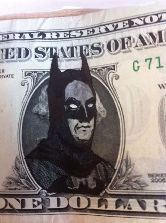 a one dollar bill with the image of batman on it's face is shown