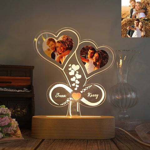 a couple's heart shaped photo lamp with three photos in the shape of hearts