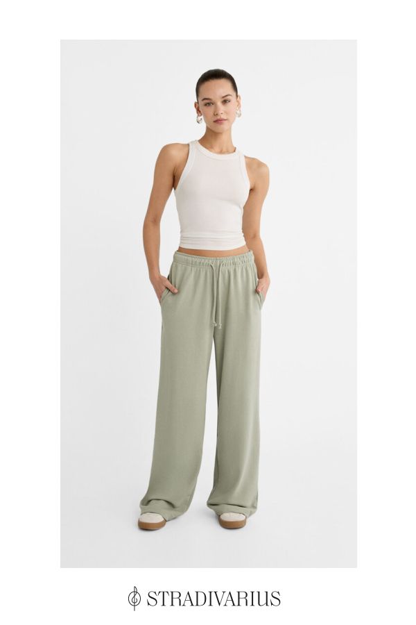 Flowing long trousers with a straight and wide leg design. Elastic waist and with adjustable matching drawstrings. Side pockets. Available in several colours. Athleisure Straight Pants With Elastic Waistband, Wide Leg Joggers With Drawstring For Loungewear, Casual Wide Leg Loungewear Pants, Straight Leg Joggers For Loungewear, Trendy Straight Leg Joggers For Loungewear, Relaxed Straight Leg Sweatpants With Ribbed Waistband, Relaxed Straight Leg Joggers With Elastic Waistband, Relaxed Style Sweatpants With Loosely Fitted Hips, Casual Joggers For Loungewear With Elastic Side Panels