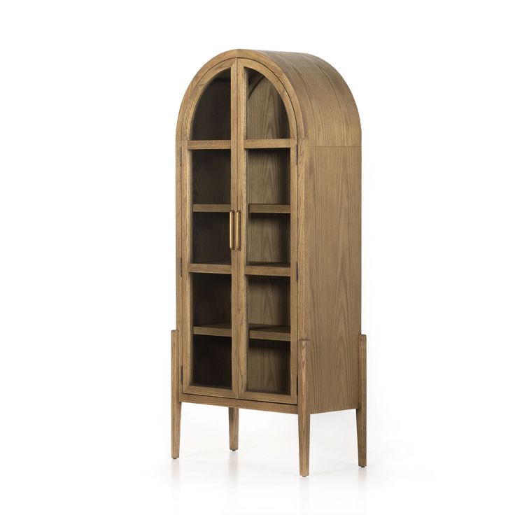 a wooden bookcase with glass doors on the front and bottom shelves, in an arch shape