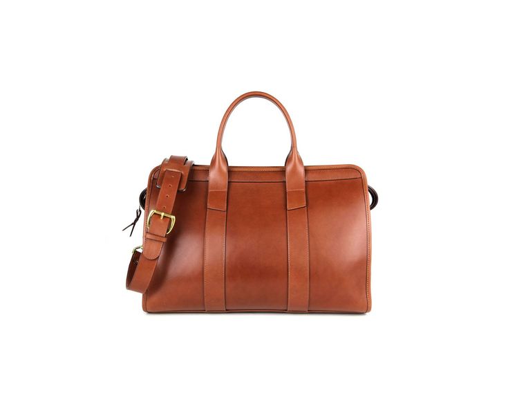 This is a small handmade leather duffle. A great gym bag for the busy executive which would complement one of our briefcases. Leather-lined Duffle Bag Satchel For Everyday Use, Everyday Duffle Bag With Leather Lining, Satchel Shape, Cognac Leather-lined Duffle Bag For Daily Use, Leather Duffle Bag With Zipper For On-the-go, Brown Leather-lined Rectangular Duffle Bag, Travel Duffle, Leather Duffle, Gym Bag, Leather Handmade