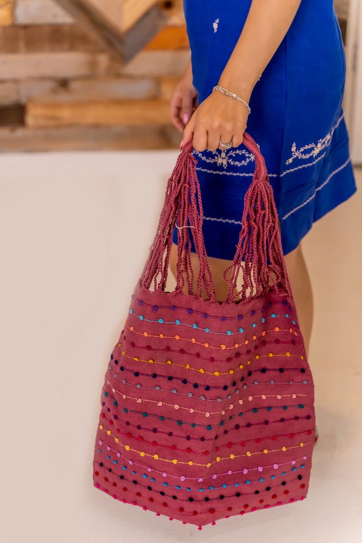 Sara Tote Bag This handmade Mexican tote bag is crafted using a traditional waist loom technique, known as telar de cintura, ensuring each piece is unique and full of cultural heritage. Authentic Craftsmanship: Made with care and precision, each tote bag takes 1 to 2 weeks to create, showcasing the dedication and skill of the artisans. Colors: Medallion, Pastel, Boysenberry Handmade Multicolor Folk Bags, Red Handwoven Crochet Shoulder Bag, Handwoven Crochet Shoulder Bag For Festival, Red Handwoven Tote Bag, Traditional Tote Bag With Weaving Work, Handwoven Red Crochet Shoulder Bag, Traditional Woven Shoulder Bag For Everyday Use, Traditional Brown Woven Beach Bag, Handwoven Hobo Tote Bag For Market