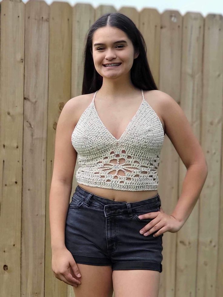 This crocheted flower top is perfect for summer time! It is super comfortable and stylish! See the size chart to determine your size. The model pictured is size medium. Fitted V-neck Crochet Top For Summer, Crochet Lace V-neck Crop Top For Summer, Summer V-neck Tops With Crochet Lace, Summer V-neck Crochet Crop Top, Summer Stretch Crochet Top For Beach Season, Stretch V-neck Crochet Top For Summer, Trendy Stretch Crochet Top For Beach, Spring Crochet V-neck Top, Casual Summer Crochet Top With Crochet Trim