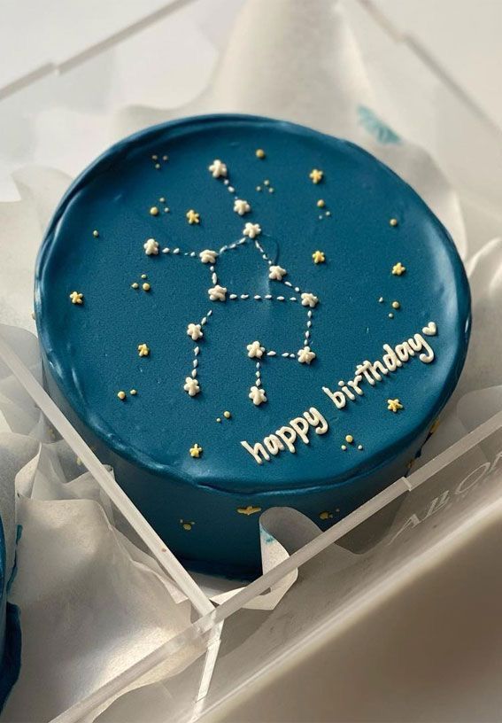 a blue birthday cake with stars on it