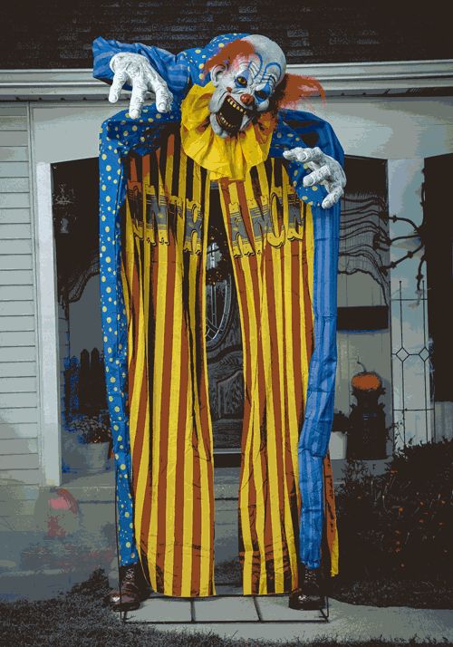 a creepy clown standing in front of a house