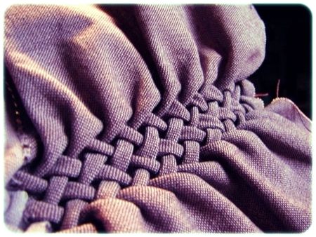 an image of a blanket that is purple and has squares on the top of it