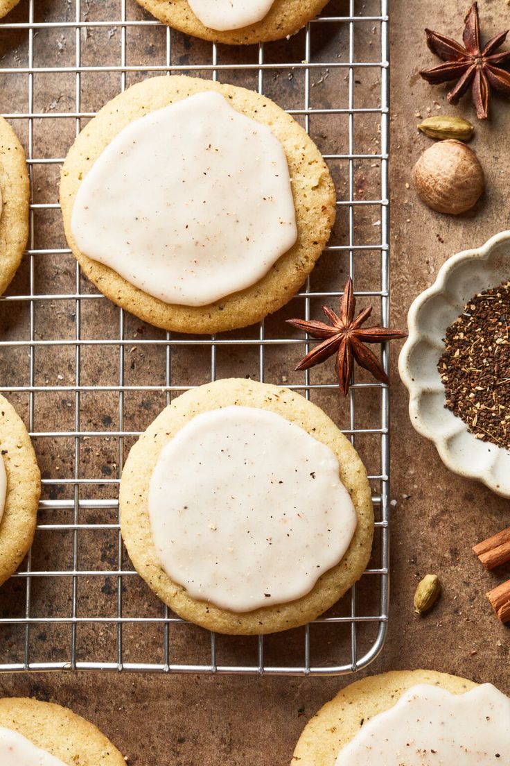 cookies with icing and spices on a cooling rack