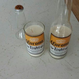 two empty glass bottles sitting on top of a counter