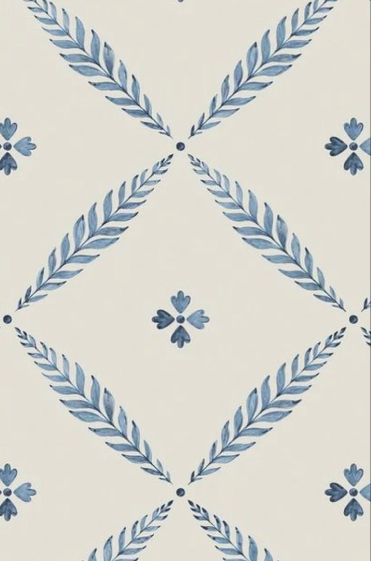 a blue and white wallpaper with leaves on it