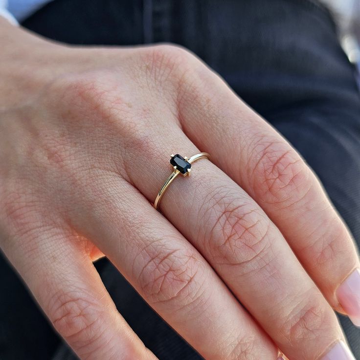 💎Elevate your style with our 14K Gold Black Onyx Ring. This stunning Vertical Solitaire Black Gemstone Gold Ring features a Baguette Octogon Cut Dark Stone that exudes elegance. The perfect Dainty Best Friend Gift, this ring is a timeless statement piece. Crafted with care and precision, it's designed to complement any outfit and make you shine. 💎 F E A T U R E S ▸ Made to Order ▸ Custom Gold Color: Yellow Gold, Rose Gold, White Gold ▸ Band Width: 1.30mm / 0.04in ▸ Material: Solid Real Gold (n Classic Black Baguette Cut Rings, Black Sapphire Ring In 14k Gold, Minimalist Black Sapphire Ring For Gift, Minimalist Black Sapphire Ring As Gift, Minimalist Black Emerald Cut Jewelry, Black Fine Jewelry Rings For Everyday, Everyday Black Fine Jewelry Ring, Everyday Fine Black Ring, Black Sapphire Ring In 14k Gold As Gift