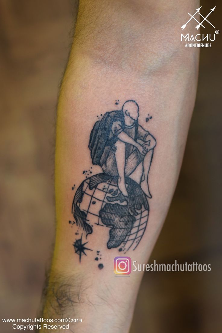 a couple hugging on top of a globe tattoo