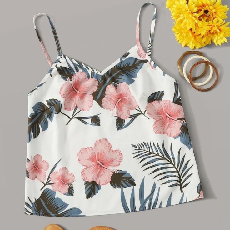 Floral Spaghetti String Crop Top White Summer Vacation Camisole, White Floral Print Cami Tank Top, Beach Floral Camisole, Floral Print Vacation Camisole, Floral Print Camisole For Vacation, Vacation Floral Print Camisole, Floral Print Cami Camisole For Beach, White Camisole With Adjustable Straps For Vacation, White Summer Camisole With Spaghetti Straps