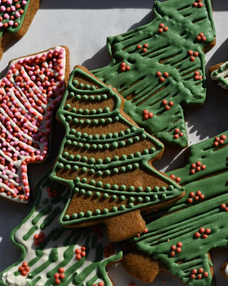 decorated christmas cookies with sprinkles and trees