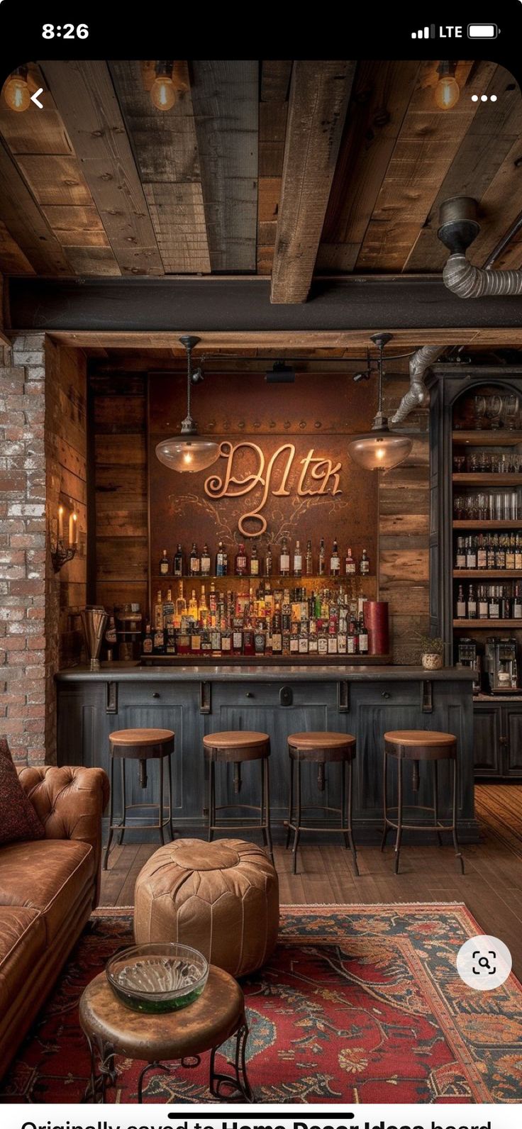 the interior of a bar with stools and tables