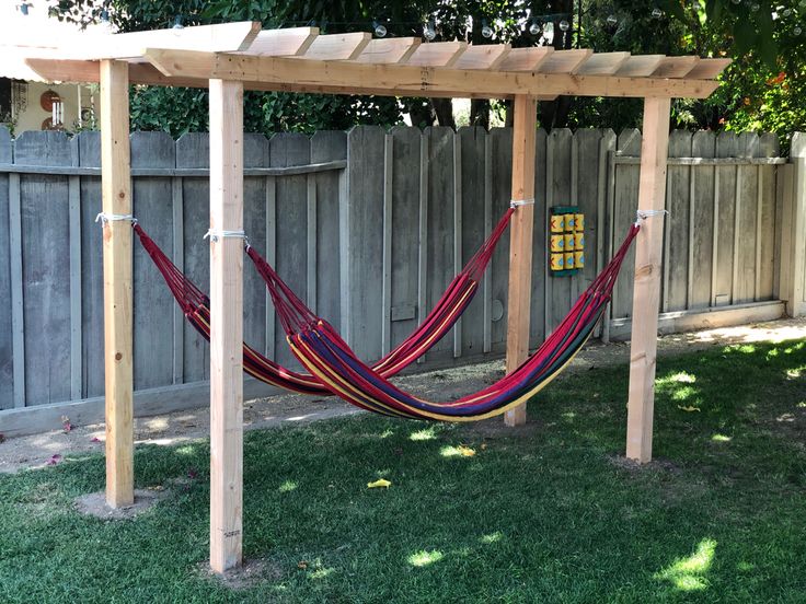 a hammock hanging from a wooden structure