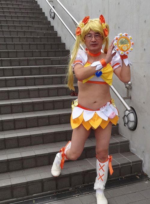 a woman dressed in costume standing next to some stairs