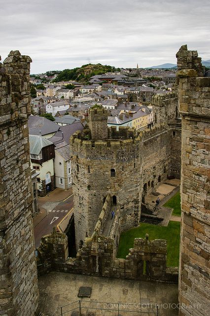 an aerial view of the city and its surrounding castle like structures, including two towers