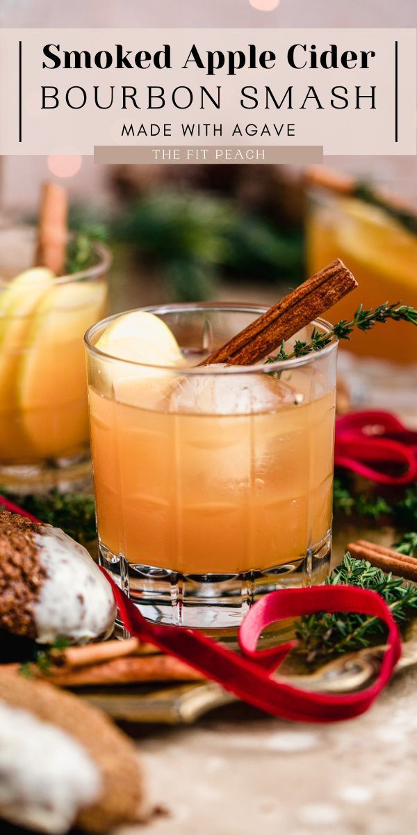 an apple cider cocktail is garnished with cinnamon