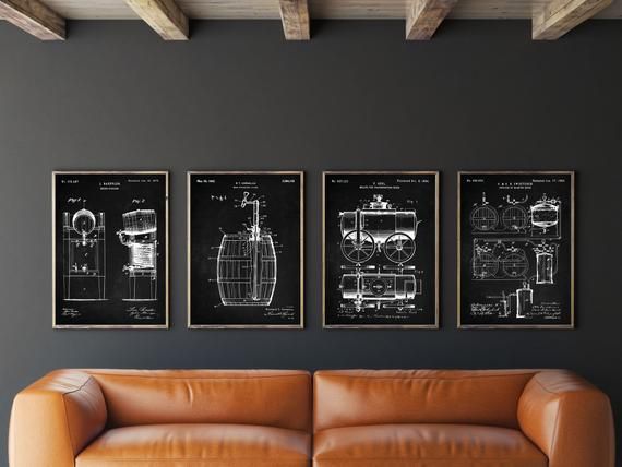 three black and white prints hang on the wall above a leather couch in a living room