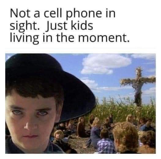 a young man wearing a black hat and standing in front of a cross with the caption, keep others afraid of you refer to autumn as harvest time