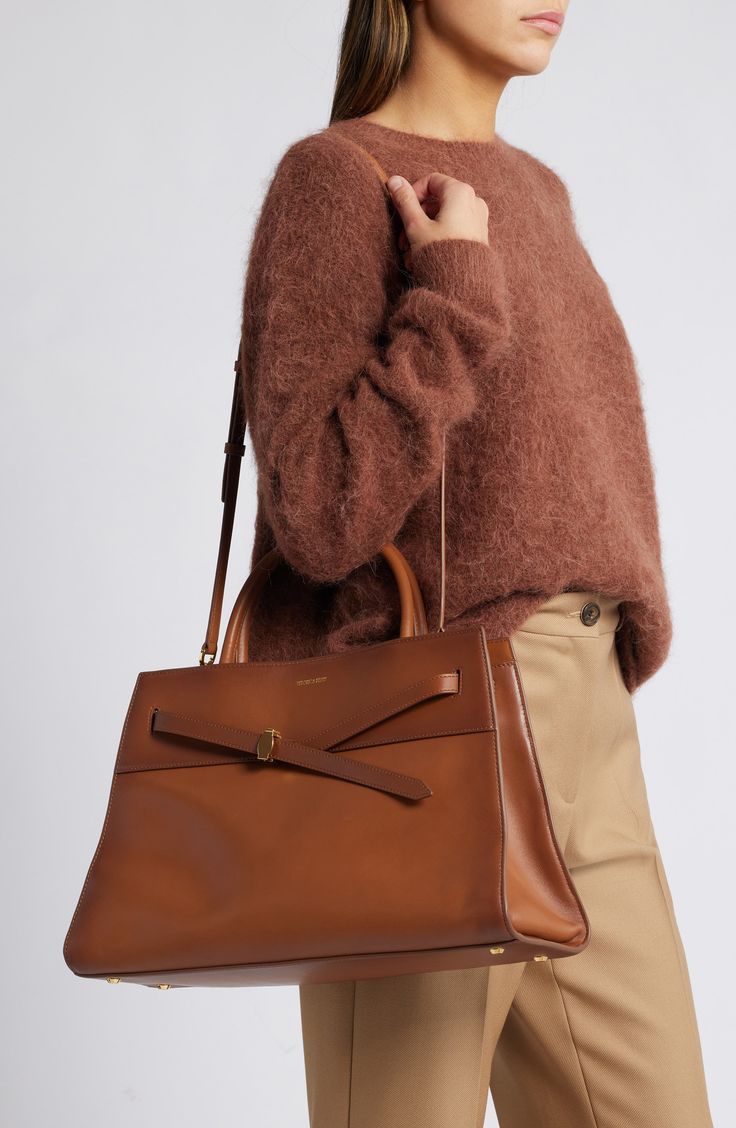 Brown Briefcase With Gold-tone Hardware For Work, Luxury Brown Shoulder Bag For Work, Calf Leather Bags For Work In Fall, Calf Leather Bags For Workwear And Fall, Calf Leather Bags For Fall Workwear, Luxury Leather Handle Shoulder Bag For Fall, Luxury Brown Satchel For Workwear, Timeless Fall Travel Bags, Luxury Cognac Shoulder Bag For Fall