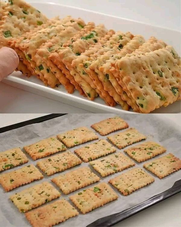 crackers are being made on a baking sheet and then placed on a cookie sheet