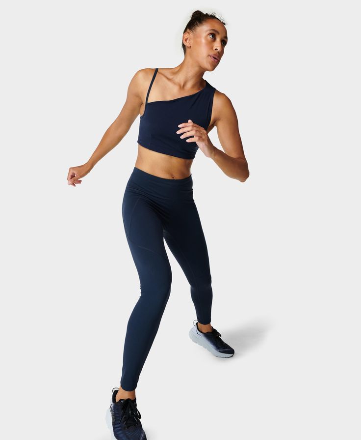 Our multi-sport gym leggings designed for every workout. Stretchy fabric with flattering seams to sculpt the bum. Sweat-wicking, quick-drying and breathable. Side pocket and back zip pocket. Internal adjustable drawcord. Inseam length size S: 68cm / 27". Model wears size S and is 178cm/5'10" tall. Style Code: SB5400Colour: Navy Blue Sports Activewear With 4-way Stretch, Breathable 4-way Stretch Tights For Workout, Breathable 4-way Stretch Gym Leggings, Breathable 4-way Stretch Leggings For Gym, Functional Elastane Gym Pants, Functional Elastane Pants For Gym, Micro-elastic Sporty Running Leggings, 4-way Stretch Sportswear Leggings For Sports, 4-way Stretch Sports Leggings