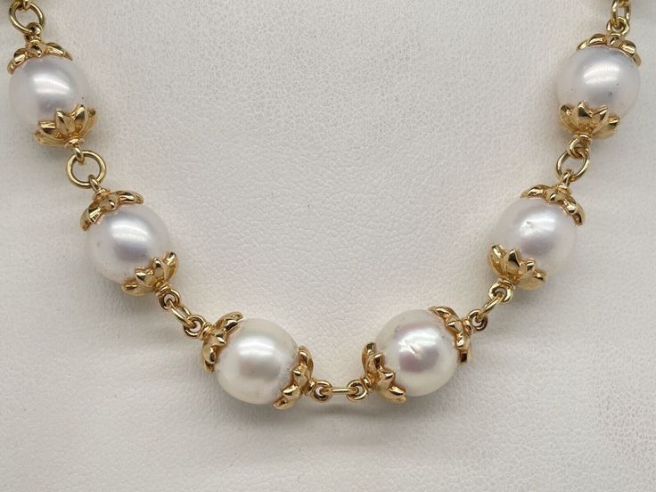 14k Yellow Gold Capped Pearl Necklace. It measures 18” long and weighs an impressive 52.6 Grams. The pearls measure around 9mm with some a little bigger. There are 22 pearls in the necklace. The lobster claw is hallmarked 14k and the pearl caps were acid tested 14k gold. A bold look fit for a queen. Classic Single Strand Pearl Necklace In 14k Gold, Classic 14k Gold Pearl Necklace, Classic Round 14k Gold Pearl Necklace, Classic 14k Gold Necklace For Formal Occasion, Classic Formal 14k Gold Necklace, Classic Gold Necklaces With High Luster, Classic Gold Necklace With High Luster, Classic Single Strand 14k Gold Jewelry, Classic Oval Necklace Stamped 14k