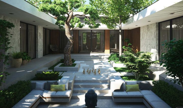 a courtyard with couches and trees in the middle, surrounded by greenery on both sides