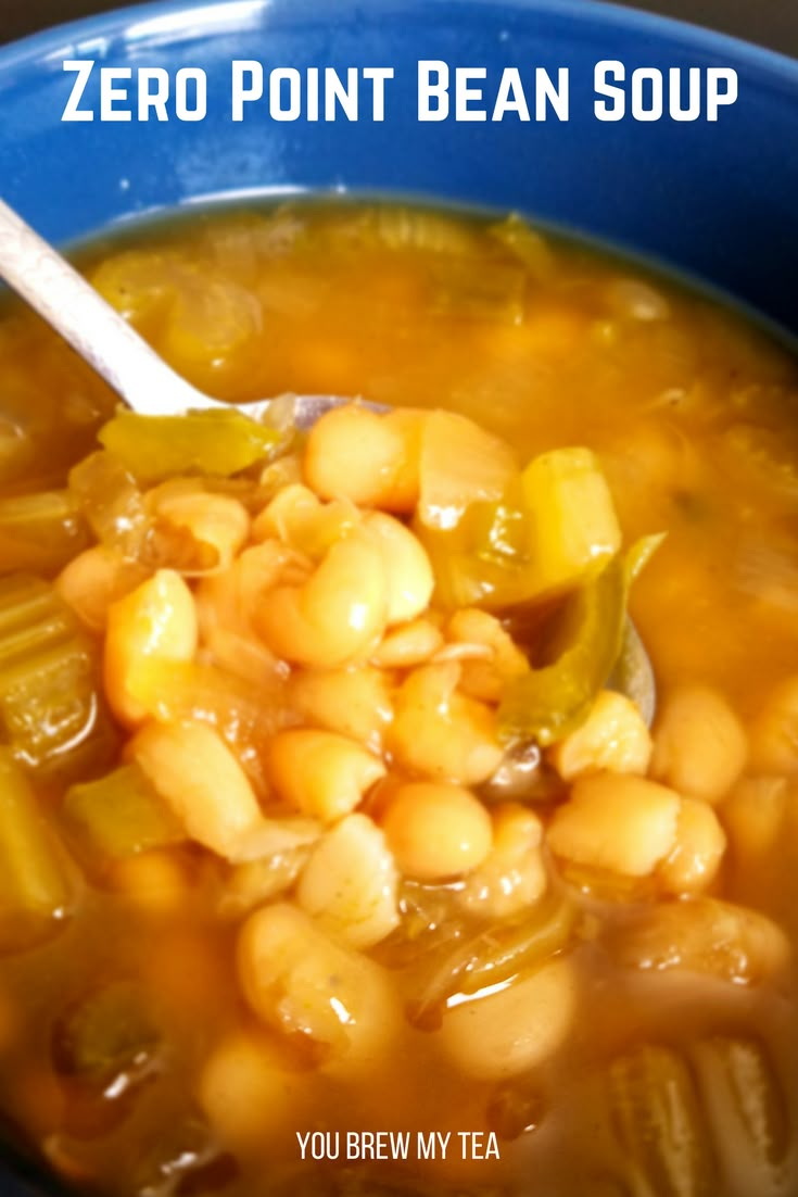 a blue bowl filled with beans and corn