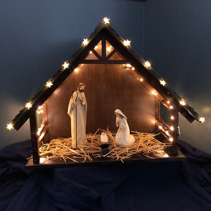 a nativity scene with three wise men in the manger