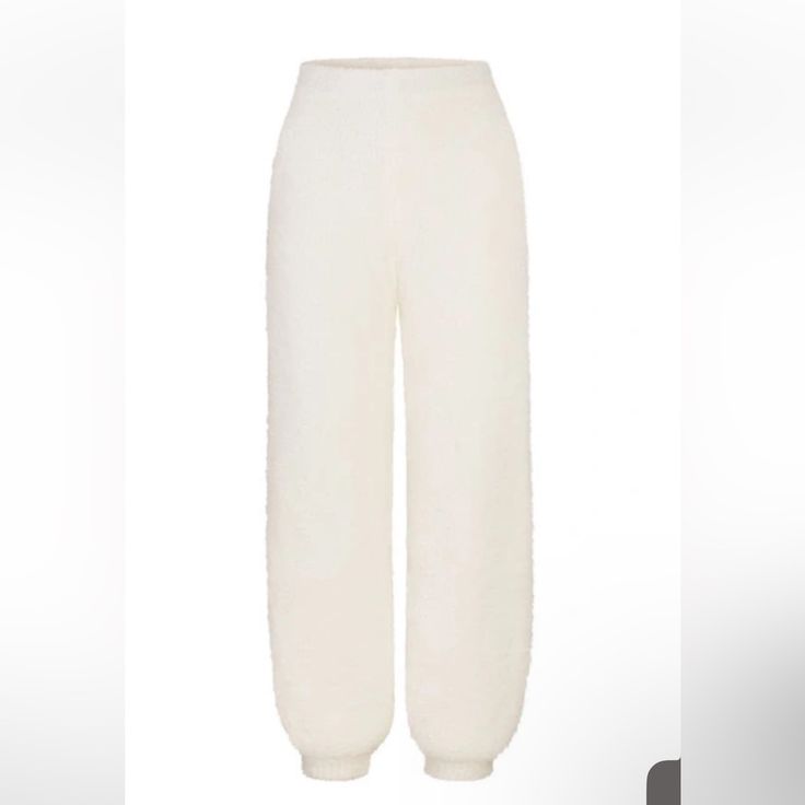 Plush And Decadently Soft, These Easy-Fitting Joggers That Make All Your Dreams Sweeter Are From Kim Kardashian West's Highly Sought-Out Skims. Elastic Waist Elastic Cuffs 76% Polyester, 24% Nylon Hand Wash, Dry Flat Imported Nwt Cozy Winter Loungewear Sweatpants, Cozy Winter Pants With Ribbed Cuffs, Super Soft Winter Loungewear Bottoms, Winter Loungewear Pants With Ribbed Cuffs, Cozy Winter Bottoms With Ribbed Cuffs, Winter Loungewear Snug Bottoms, Cozy Winter Sweatpants For Lounging, Winter Lounging Pants With Ribbed Cuffs, Solid Winter Lounging Pants