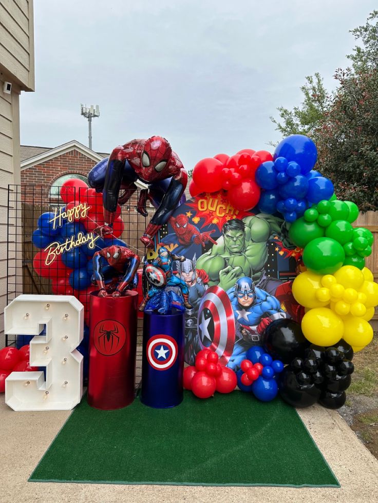 balloons and heliums are on display in front of a house