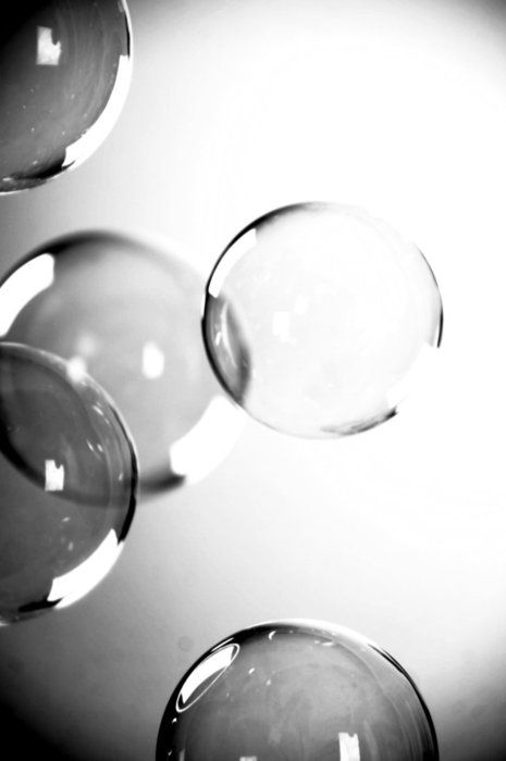 three wine glasses sitting on top of a table