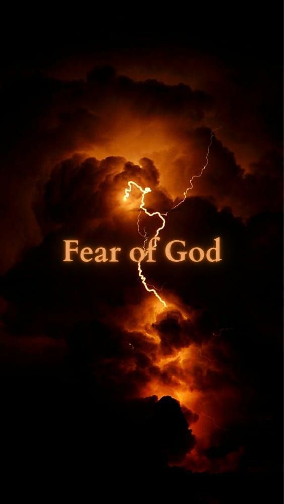 the words fear of god in front of a dark sky with clouds and lightnings