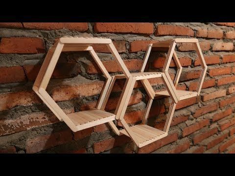 three wooden shelves on the side of a brick wall