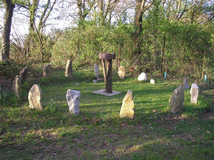 an old cemetery with many headstones in the grass