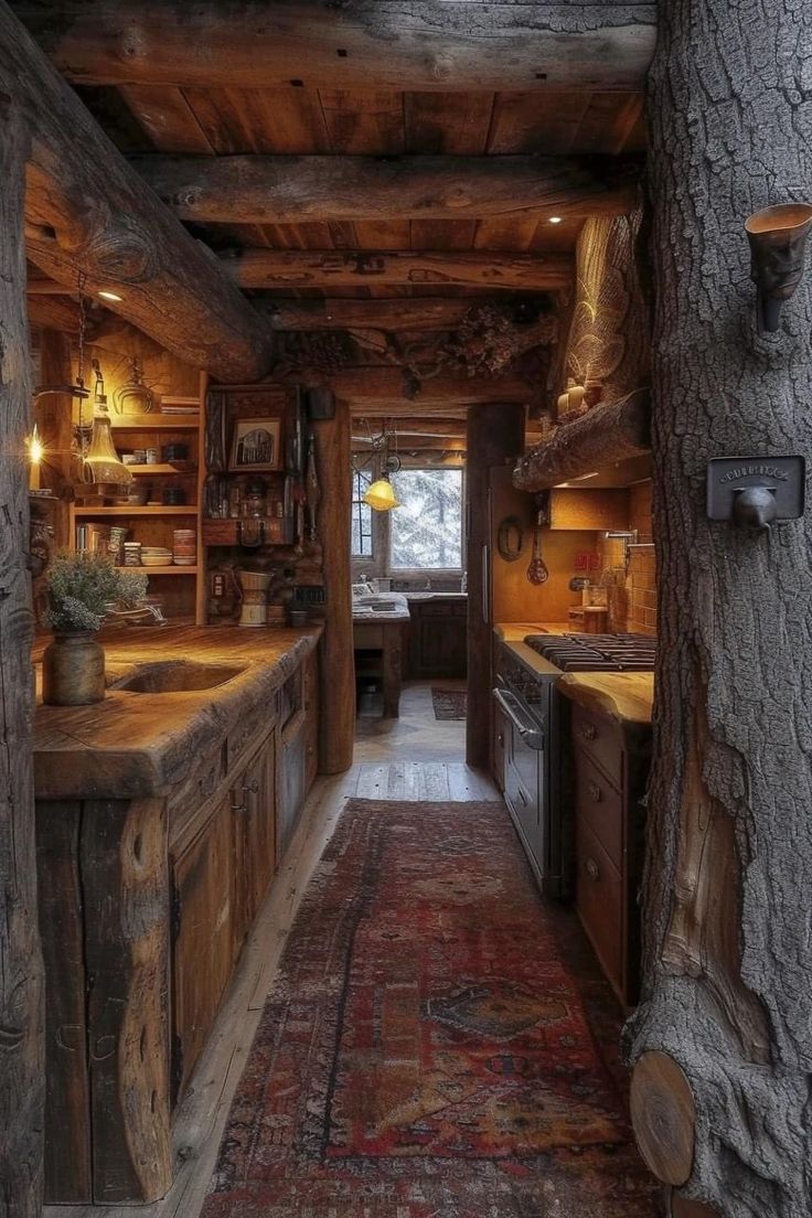 an old log cabin kitchen with wooden cabinets and counter tops, along with a rug on the floor