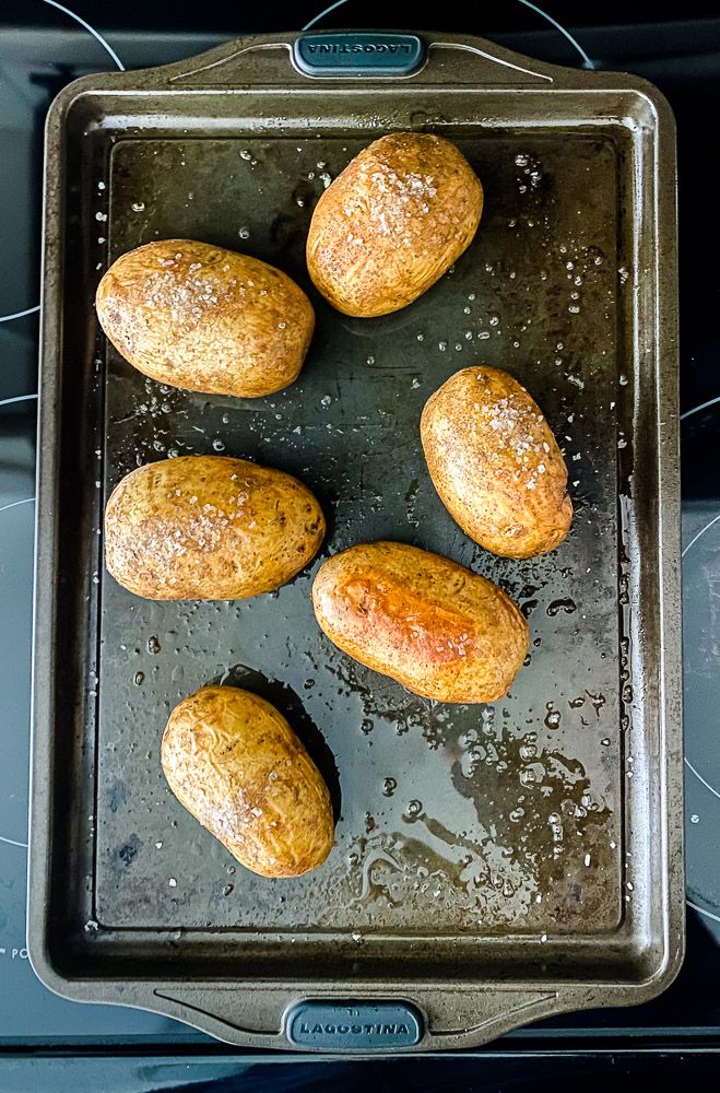 six baked goods sitting on top of a baking pan